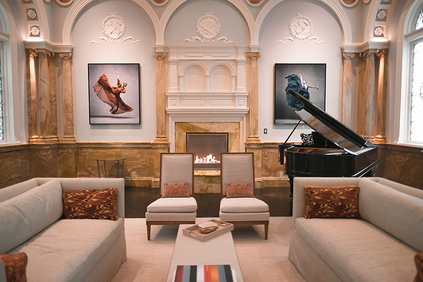 The fireplace area of the music room in historic Boston home